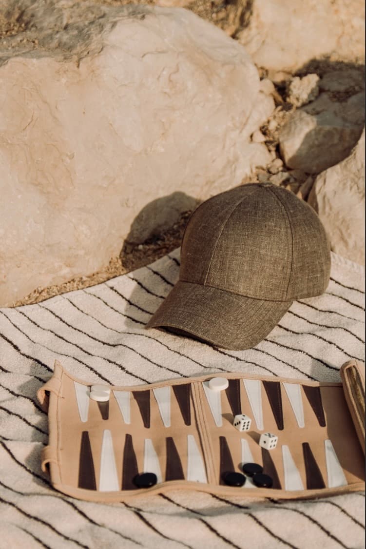 Cap and backgammon games on the beach in Saint Tropez