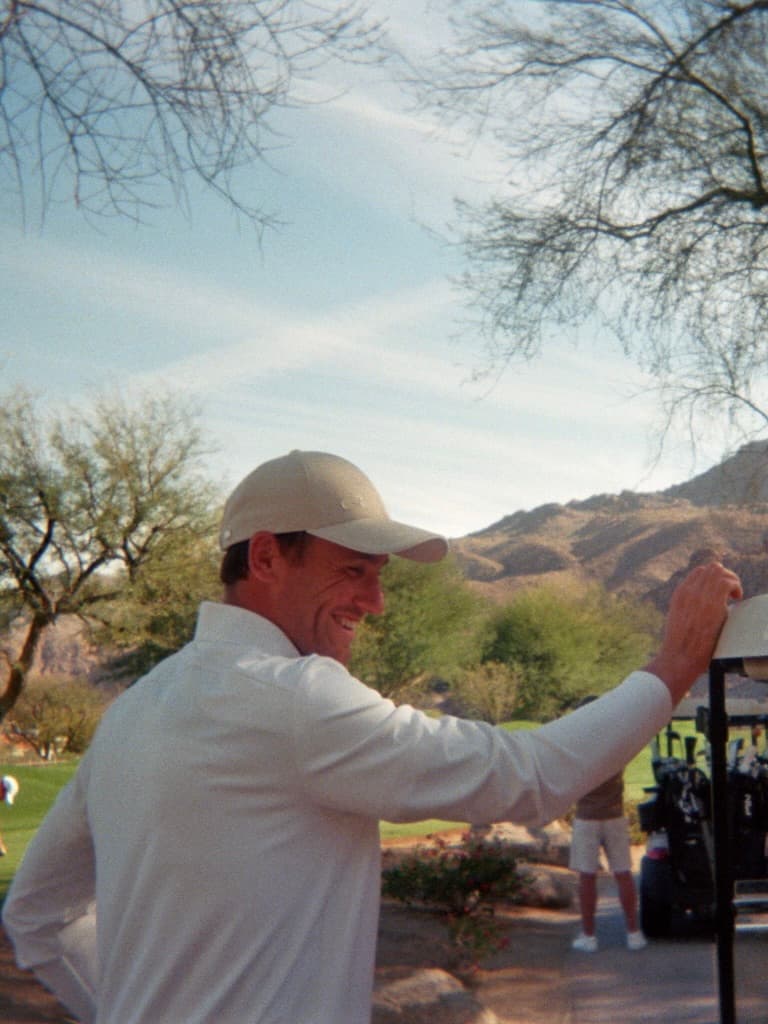 Behind the scenes image of Casper Ruud at the campaign shoot with Varsity Headwear in Palm Springs