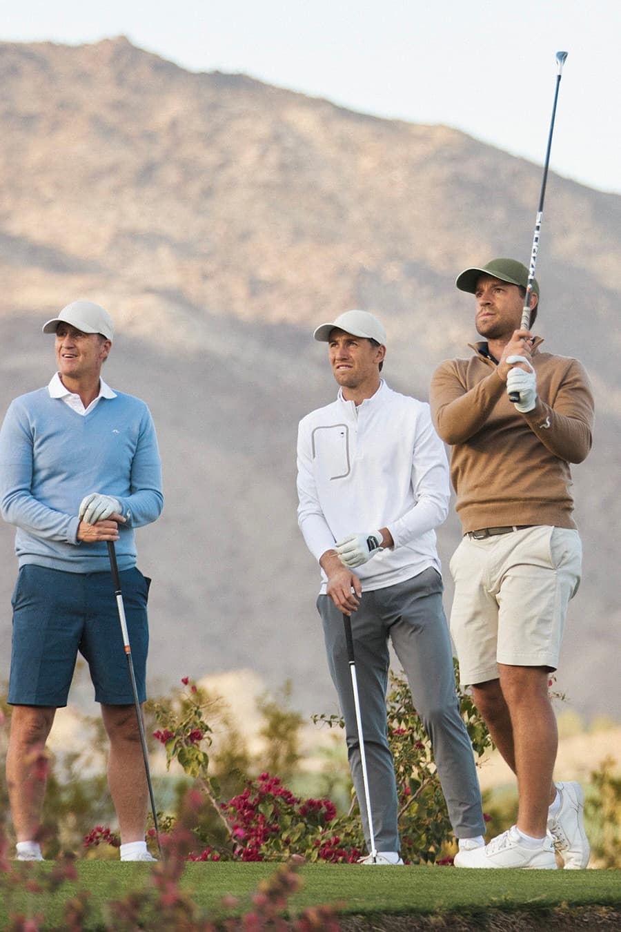 Casper Ruud and team wearing Varsity Headwear caps while playing golf