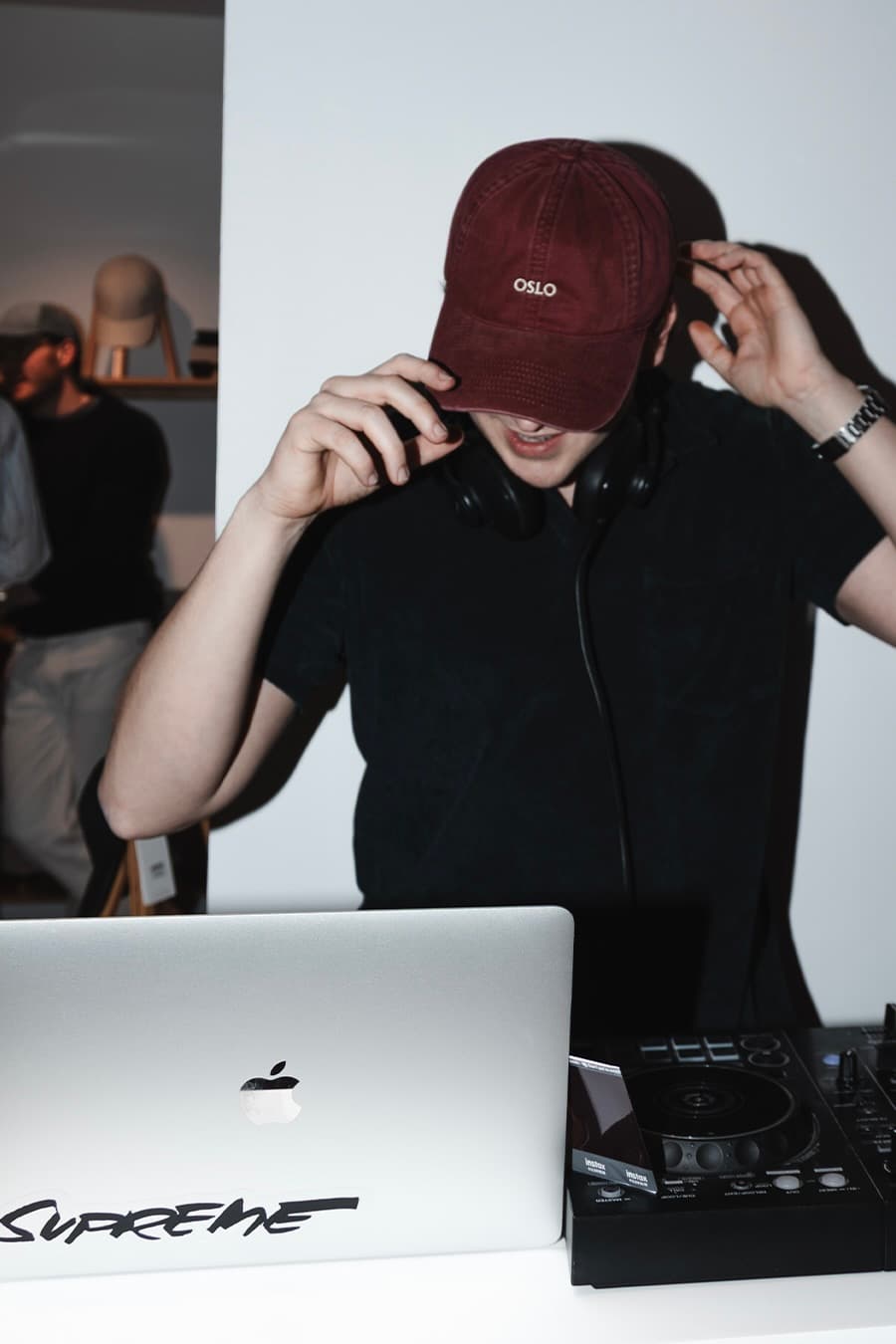 Dj playing music at opening event of Varsity Headwear new concept store in Oslo