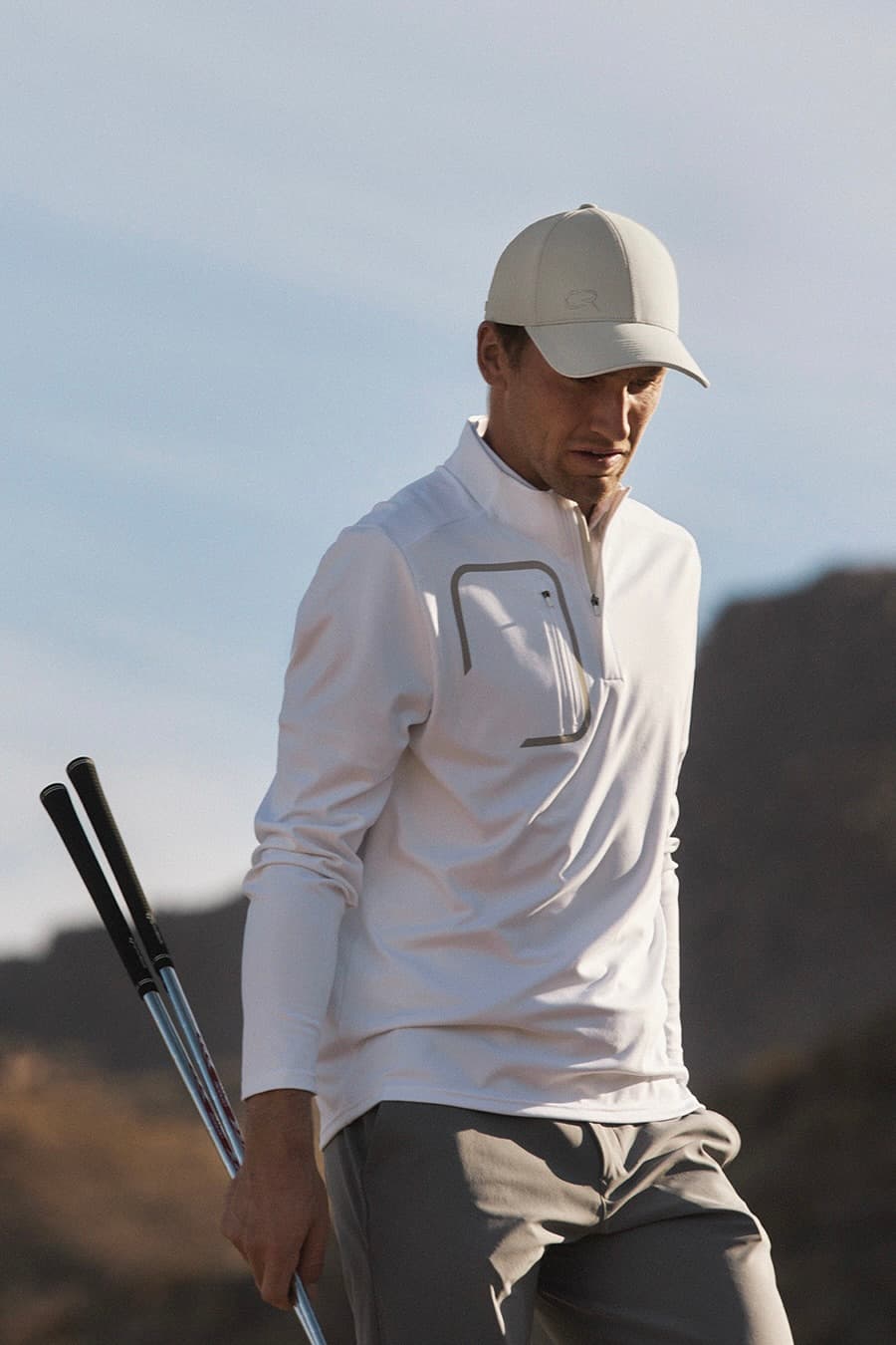 Casper RUud wearing Varsity Headwear cap at golf course