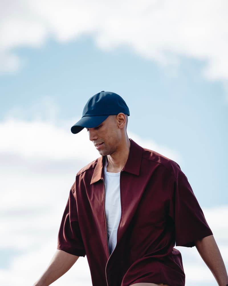 Side view of male model wearing a legacy soft seaqual cap in summer environment