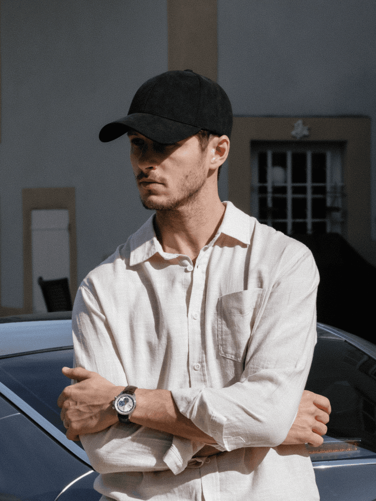 Front view of male model wearing legacy structured alcantare cap from varsity headwear